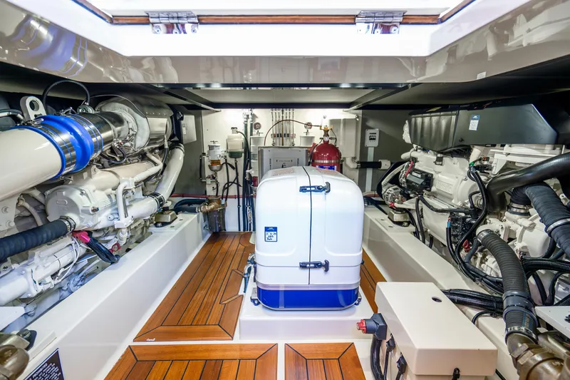 Slide: The Image of Engine room of 2020 Palm Beach Motor Yachts PB55, featuring advanced machinery and equipment. - 36