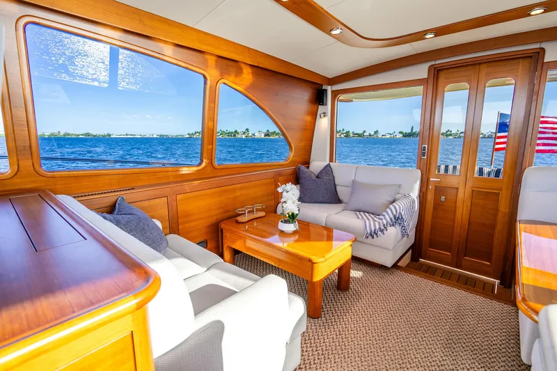 Slide: The Image of Luxurious interior of 2020 Palm Beach Motor Yachts PB55 with ocean view and elegant wood finish. - 8