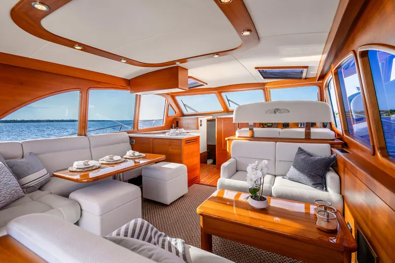 Slide: The Image of Luxurious interior of 2020 Palm Beach Motor Yachts PB55 with elegant wood finish and plush seating. - 2