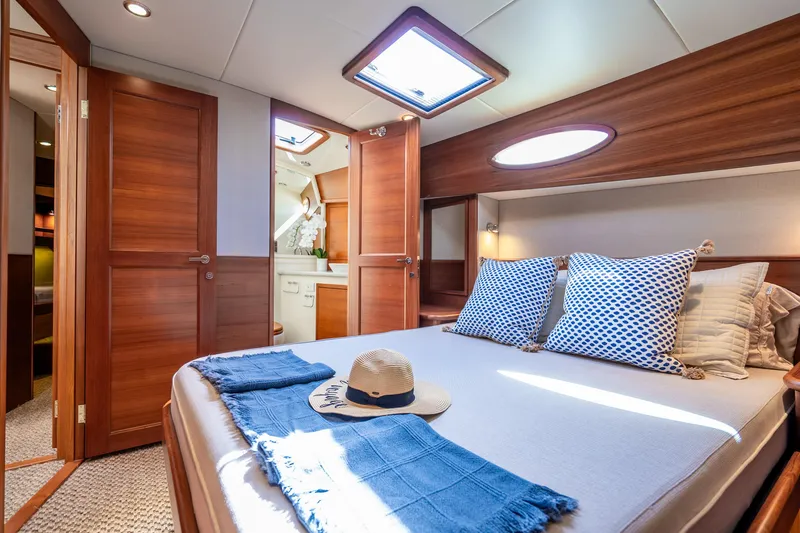 Slide: The Image of Luxurious cabin interior of 2020 Palm Beach Motor Yachts PB55 with elegant wood finish. - 20