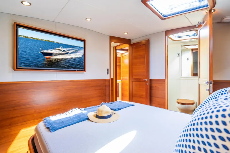 Slide: The Image of Luxurious 2020 Palm Beach Motor Yachts PB55 cabin interior with elegant wood finishes. - 22