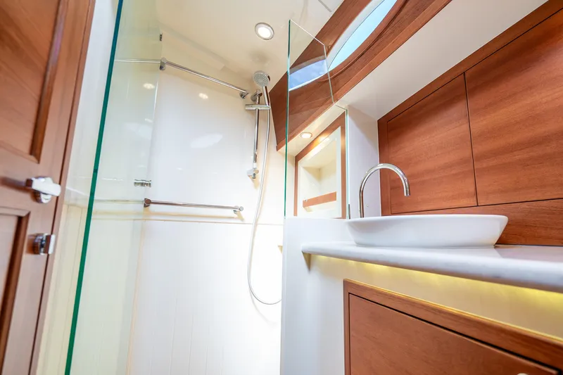 Slide: The Image of Luxurious bathroom interior of 2020 Palm Beach Motor Yachts PB55, featuring modern wood accents. - 30