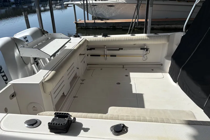 Slide: The Image of 2006 Pro-Line 32 Express boat deck with seating and fishing equipment. - 6