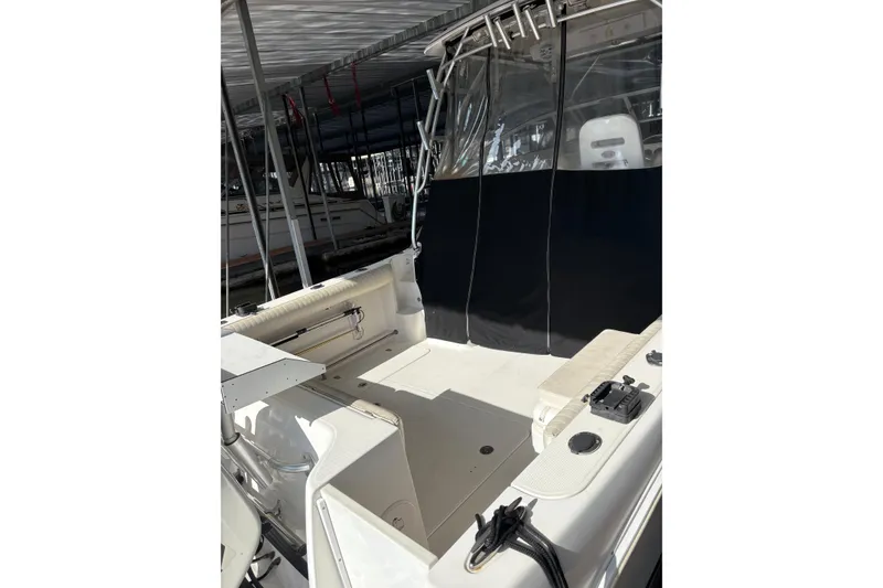 Slide: The Image of 2006 Pro-Line 32 Express boat interior with seating and fishing equipment. - 7