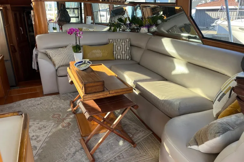 Slide: The Image of Interior of 1990 Mikelson 48 Sportfisher yacht with cozy seating and elegant decor. - 12
