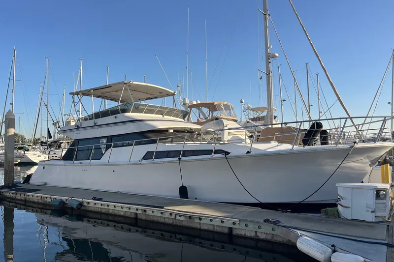 Slide: The Image of Engine of 1990 Mikelson 48 Sportfisher boat, detailed view with components and wiring. - 25