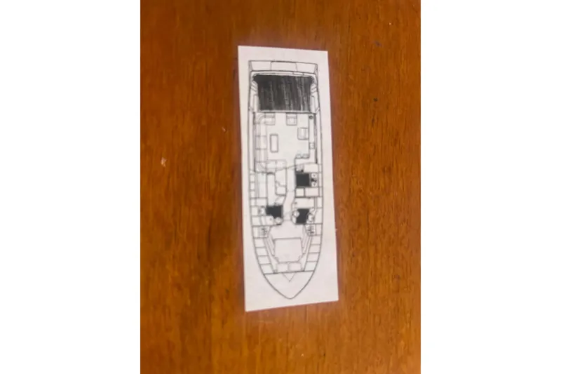 Slide: The Image of Control panel of a 1990 Mikelson 48 Sportfisher with gauges and switches. - 26