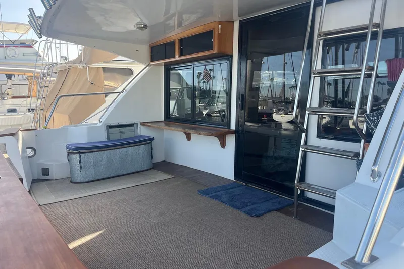 Slide: The Image of Helm of 1990 Mikelson 48 Sportfisher with steering wheel, gauges, and controls. - 3