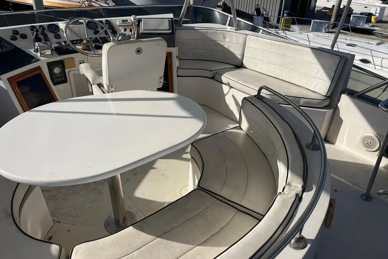 Slide: The Image of Interior of 1990 Mikelson 48 Sportfisher yacht with seating and helm. - 5