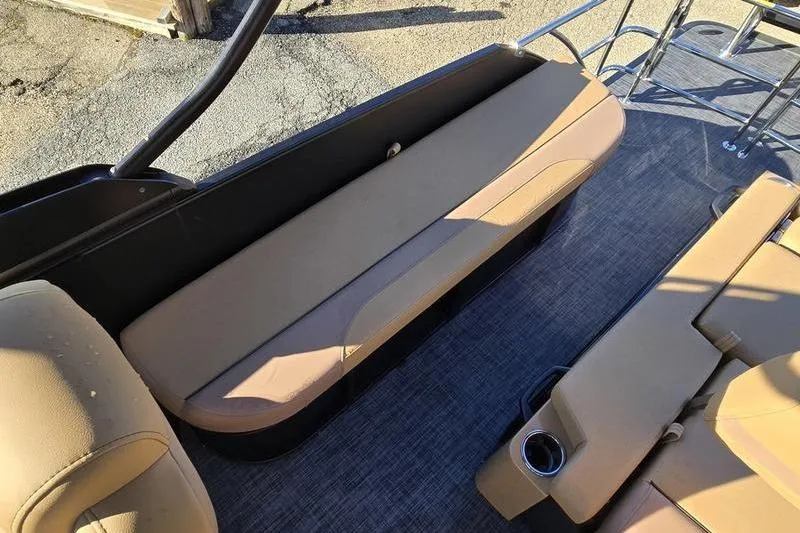 Slide: The Image of 2026 Godfrey Monaco 235 SFL boat interior with tan seating and cup holder. - 13