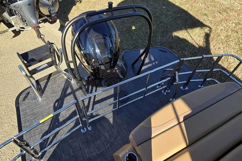 Slide: The Image of 2026 Godfrey Monaco 235 SFL boat deck with motor and seating area. - 16