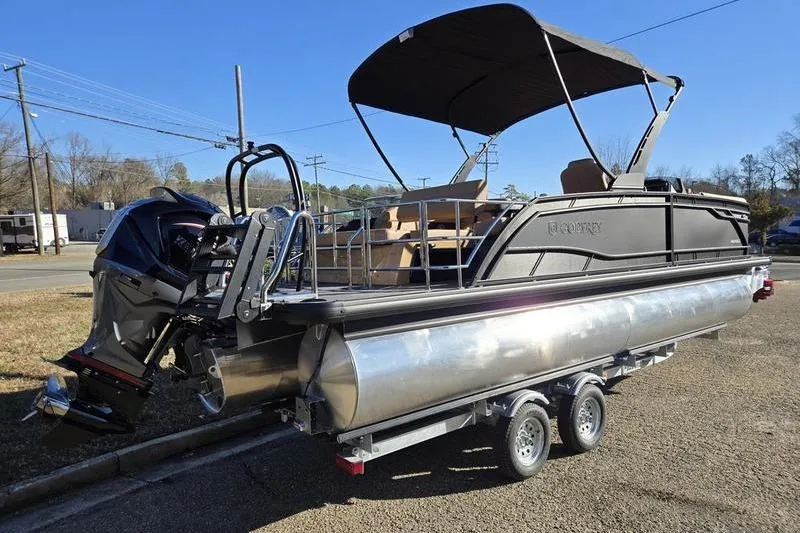 Slide: The Image of 2026 Godfrey Monaco 235 SFL pontoon boat on trailer, featuring sleek design and powerful engine. - 4