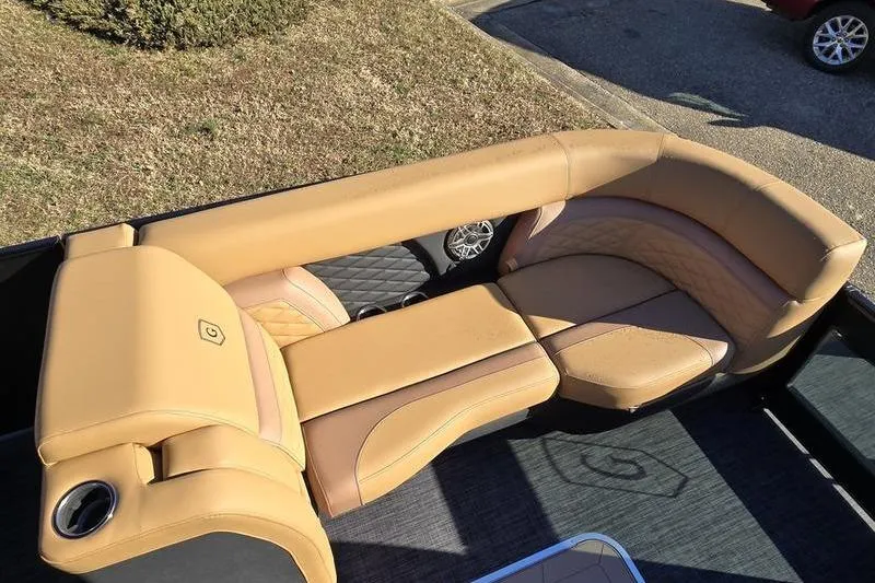 Slide: The Image of Luxurious seating on 2026 Godfrey Monaco 235 SFL boat, featuring tan leather upholstery. - 8