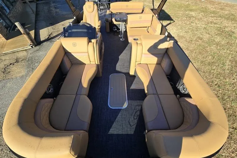 Slide: The Image of Luxurious interior of 2026 Godfrey Monaco 235 SFL pontoon boat with tan seating. - 9