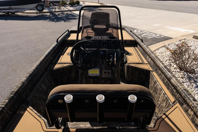 Slide: The Image of 2026 Excel 1860 Shallow Water F4 CC boat interior with steering console and seating. - 10