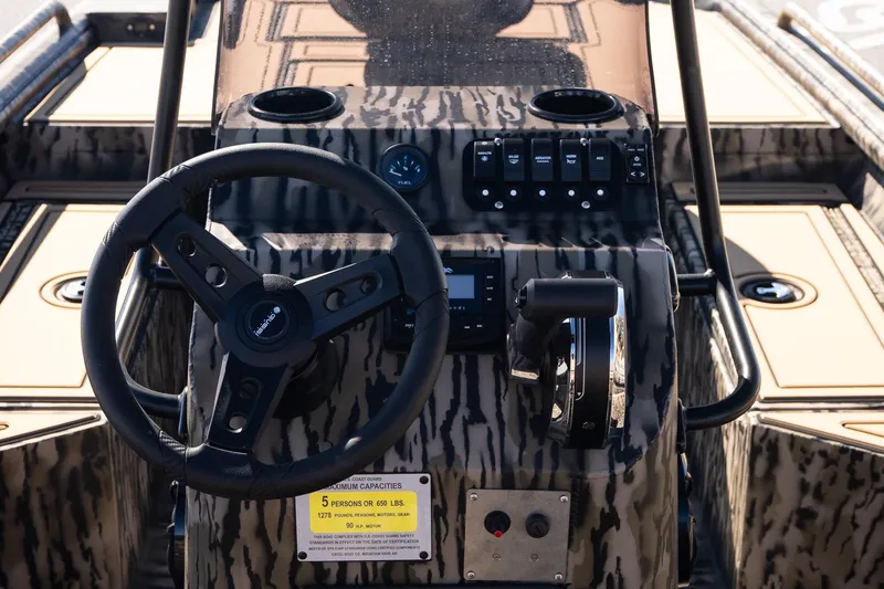 Slide: The Image of Steering console of 2026 Excel 1860 Shallow Water F4 CC boat with camouflage design. - 11