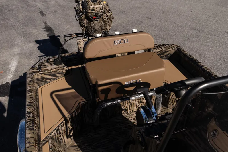 Slide: The Image of 2026 Excel 1860 Shallow Water F4 CC boat with camo design and seating. - 14