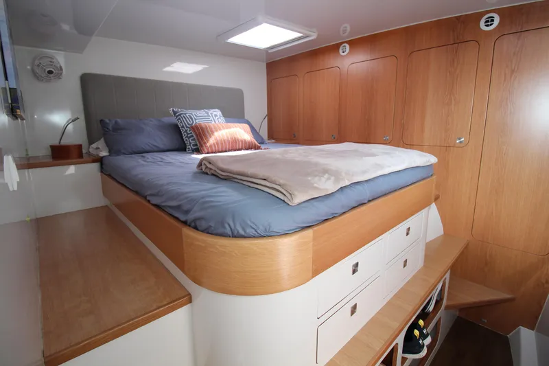Slide: The Image of Luxurious cabin interior of 2026 Chris White Spindrift 47 yacht with cozy bed and wooden storage. - 7