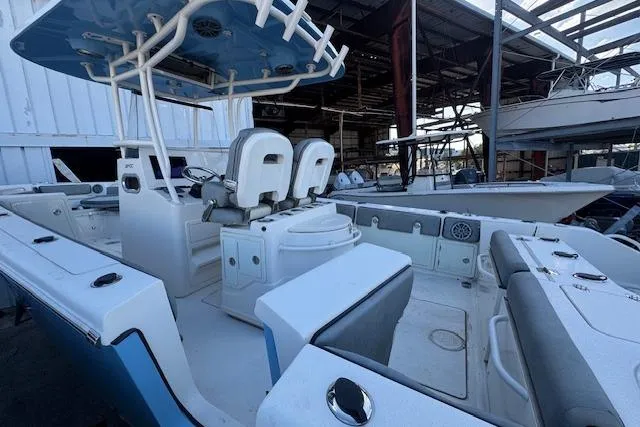 Slide: The Image of 2024 Sea Chaser 27 HFC CC boat interior with seating and helm station. - 5
