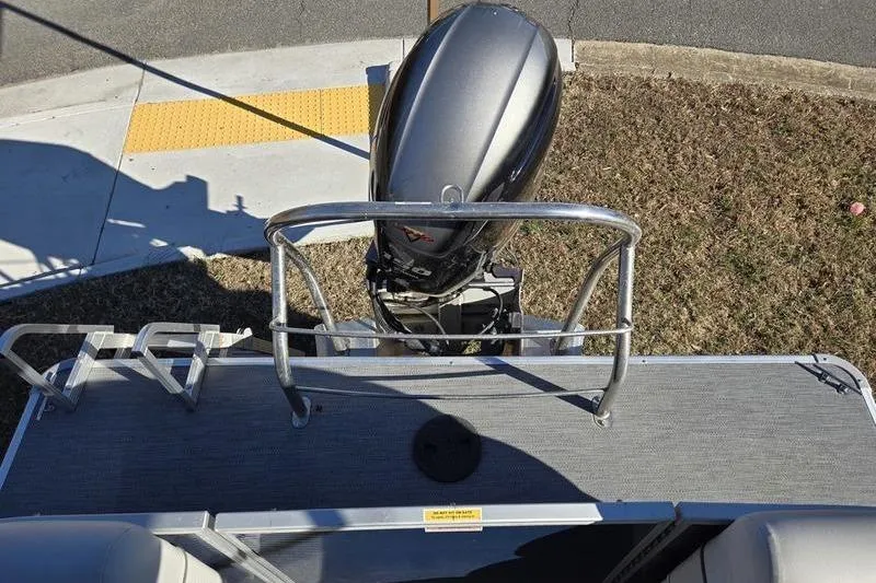 Slide: The Image of 2023 Godfrey Xperience 2286 SBX Sport Tube boat with outboard motor, rear view. - 10