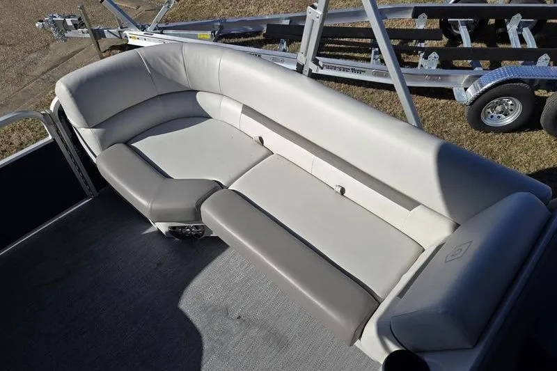 Slide: The Image of 2023 Godfrey Xperience 2286 SBX Sport Tube interior seating, featuring plush, curved upholstery. - 12
