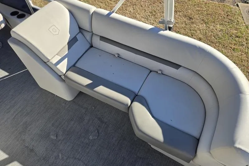 Slide: The Image of 2023 Godfrey Xperience 2286 SBX Sport Tube boat seating, featuring gray upholstery and spacious design. - 13