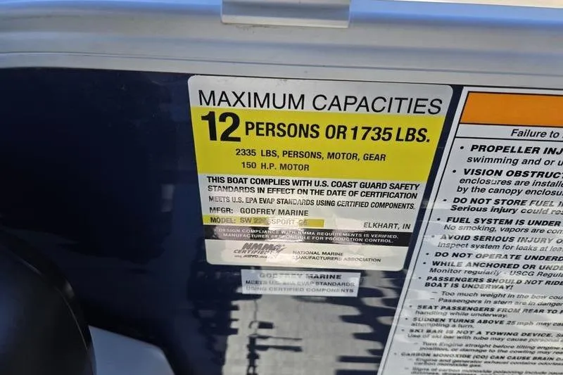 Slide: The Image of Capacity label on 2023 Godfrey Xperience 2286 SBX Sport Tube, max 12 persons or 1735 lbs. - 4