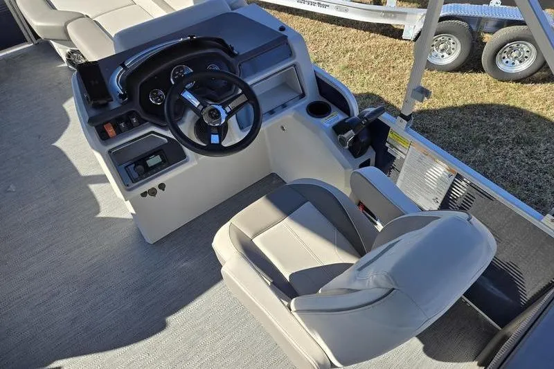 Slide: The Image of 2023 Godfrey Xperience 2286 SBX Sport Tube boat interior with steering console and seating. - 5