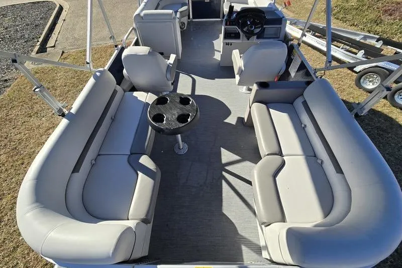 Slide: The Image of 2023 Godfrey Xperience 2286 SBX Sport Tube interior with spacious seating and central table. - 7