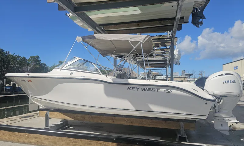The Image of 2024 Key West 239 DFS boat on a dock under sunny skies. - 0