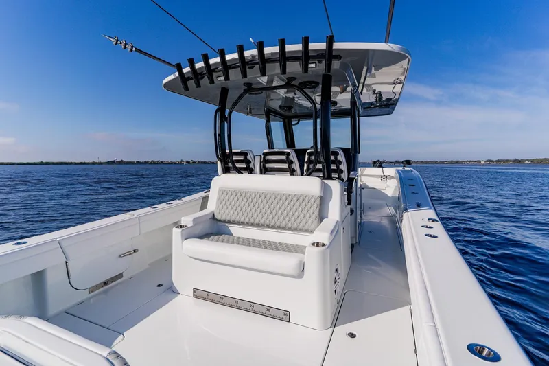 Slide: The Image of 2024 Costa Custom Boats 34SV on open water, showcasing sleek design and spacious seating. - 14