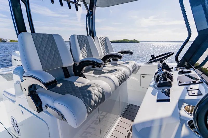 Slide: The Image of Luxurious interior of 2024 Costa Custom Boats 34SV with plush seating and modern controls. - 20