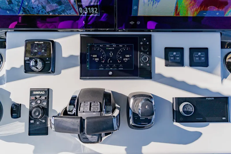 Slide: The Image of Control panel of 2024 Costa Custom Boats 34SV with advanced navigation and monitoring systems. - 22