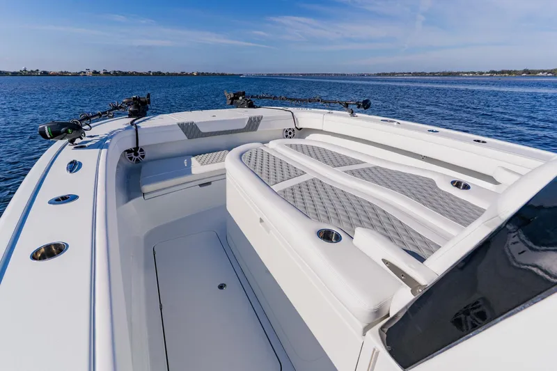 Slide: The Image of 2024 Costa Custom Boats 34SV, luxurious deck view on calm waters. - 23
