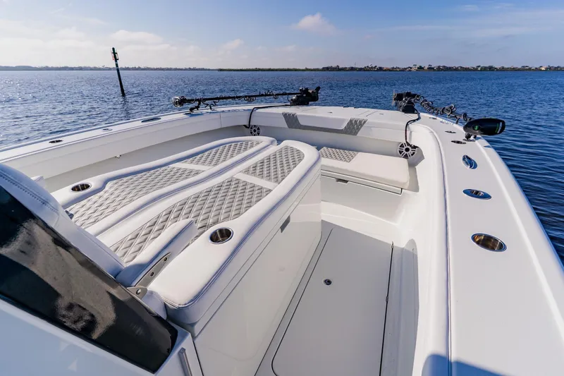 Slide: The Image of 2024 Costa Custom Boats 34SV, luxurious deck view on calm waters. - 24