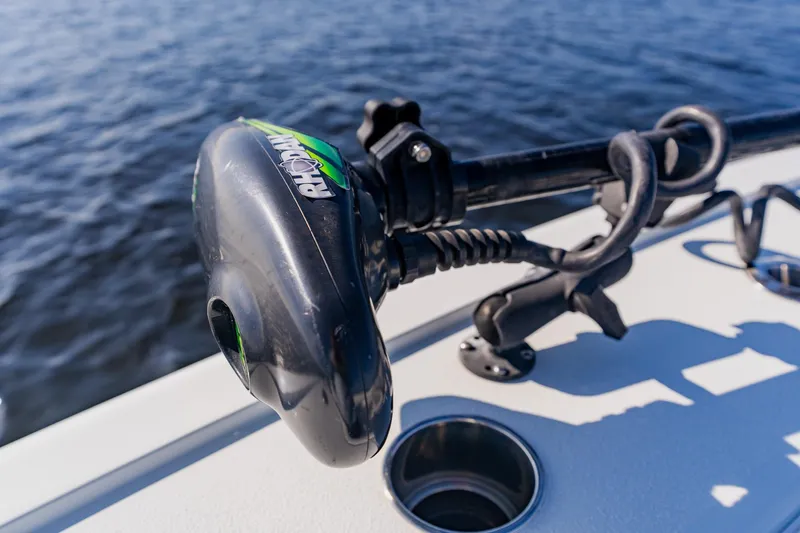 Slide: The Image of Close-up of a 2024 Costa Custom Boats 34SV trolling motor on water. - 26