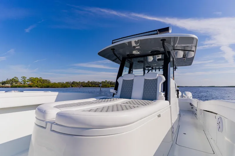 Slide: The Image of 2024 Costa Custom Boats 34SV on water, showcasing sleek design and luxury seating. - 30