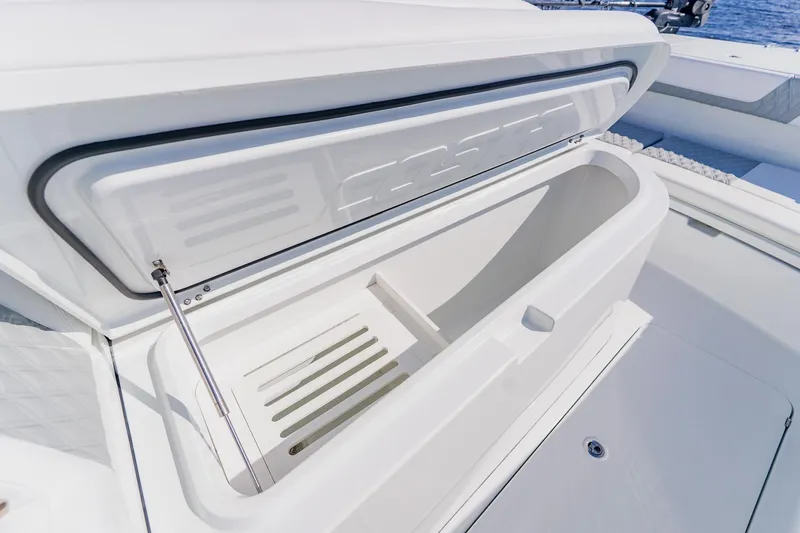 Slide: The Image of Open storage compartment on 2024 Costa Custom Boats 34SV, showcasing sleek design and functionality. - 36