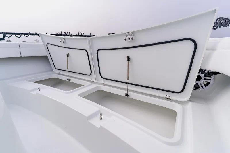 Slide: The Image of 2024 Costa Custom Boats 34SV storage compartments open on deck. - 41