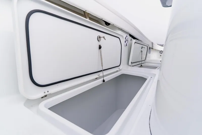 Slide: The Image of 2024 Costa Custom Boats 34SV storage compartments, sleek design, white interior, open hatches. - 42