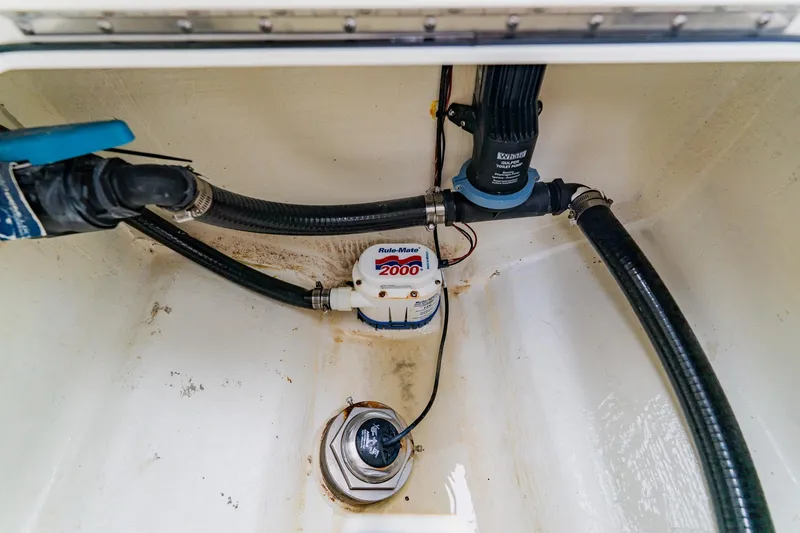 Slide: The Image of 2024 Costa Custom Boats 34SV bilge area with pump and hoses. - 46