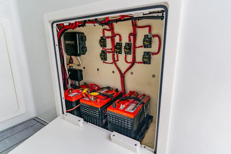 Slide: The Image of Electrical system of 2024 Costa Custom Boats 34SV, featuring batteries and wiring. - 49