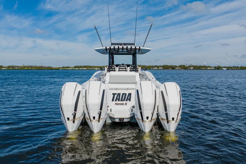 Slide: The Image of 2024 Costa Custom Boats 34SV with quad engines on open water. - 5