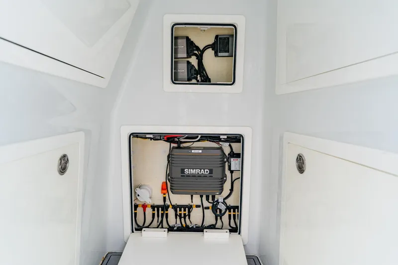 Slide: The Image of 2024 Costa Custom Boats 34SV electrical panel with Simrad system, showcasing advanced marine technology. - 50