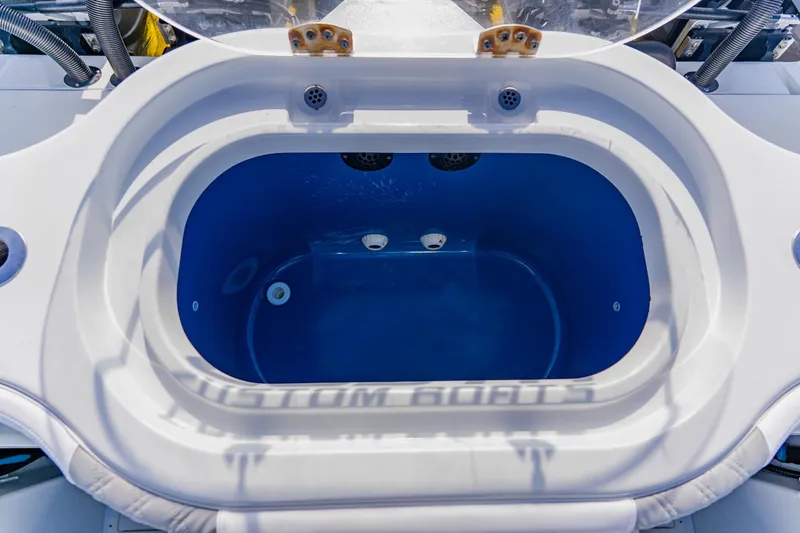 Slide: The Image of 2024 Costa Custom Boats 34SV livewell with blue interior and white exterior. - 56