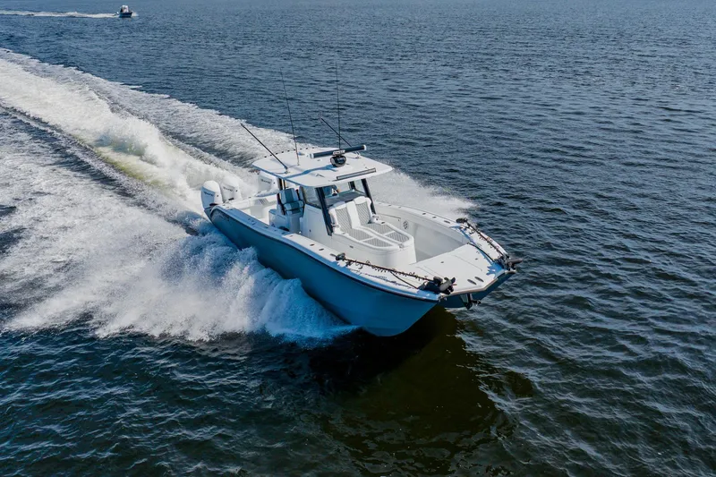 Slide: The Image of 2024 Costa Custom Boats 34SV cruising on open water, showcasing sleek design and performance. - 8