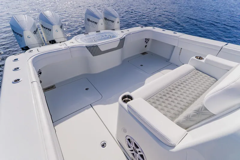 Slide: The Image of 2024 Costa Custom Boats 34SV with quad engines, luxurious seating, and sleek design on open water. - 9