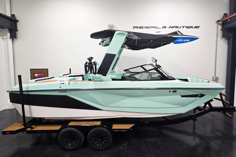 The Image of 2024 Nautique Super Air Nautique G23 boat in showroom, mint green and black design. - 0