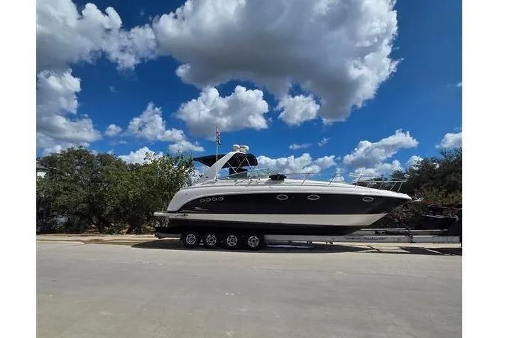 The Image of 2004 Chaparral Signature 350 on trailer under blue sky. - 0