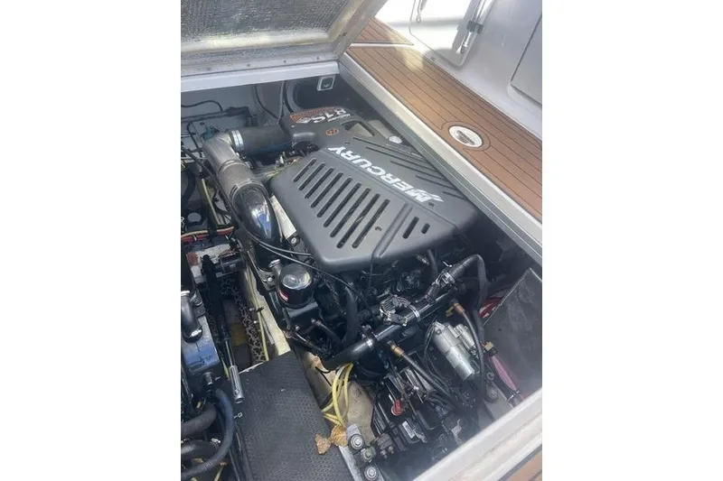 Slide: The Image of Engine compartment of a 2004 Chaparral Signature 350 with a Mercury engine. - 13